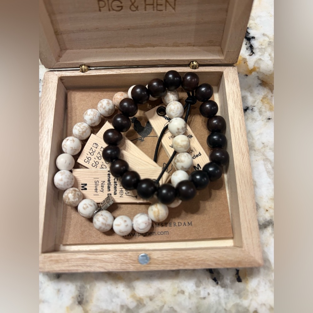 Pig & Hen Bracelets (2 included in price) black + white bracelets)